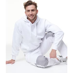 A white fleecy hoodie with a front pocket, featuring a logo, worn with matching light grey pants.