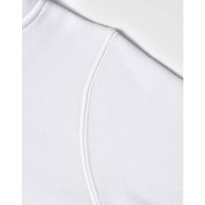 A close-up of a white fleece hoodie featuring a curved shoulder seam and a logo.