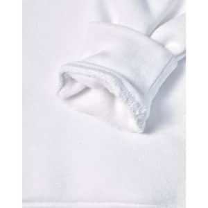 A close-up of a white fleecy hoodie sleeve featuring a soft, textured cuff. It has a logo on the fabric.