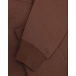 A brown unisex premium fleece oversized hoodie with ribbed cuffs and a soft finish. It features a logo.