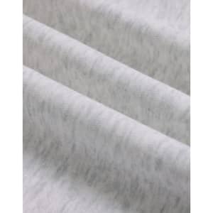 A close-up of soft, grey fabric showing a textured, fleece surface with subtle variations.