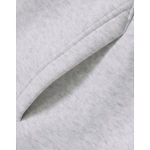 A close-up of a soft, grey fleece fabric featuring a folded edge, showcasing the texture.