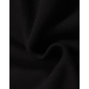 A close-up of black fleece fabric, showcasing its soft texture and smooth finish, with a logo present.