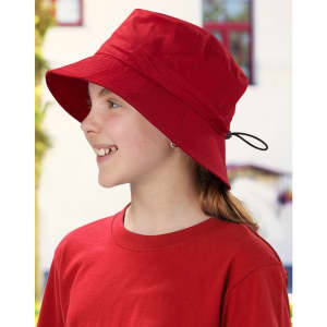A red bucket hat with a toggle feature, worn by a child, alongside a matching red shirt. The hat has a logo.