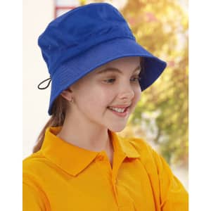 A blue bucket hat with a toggle, worn by a smiling child in a bright yellow shirt. The hat has a logo.