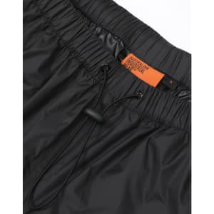 Lightweight black nylon waterproof rain pants with an elasticated waistband and drawstring, featuring a logo label.