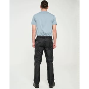 Lightweight black nylon waterproof rain pants displayed on a person from the back, wearing a grey T-shirt.