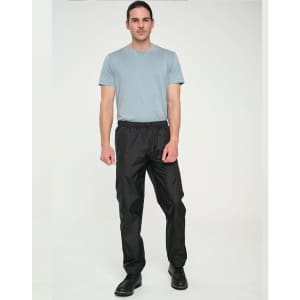 Lightweight black nylon waterproof rain pants displayed on a male model wearing a blue t-shirt. Features an elastic waistband.