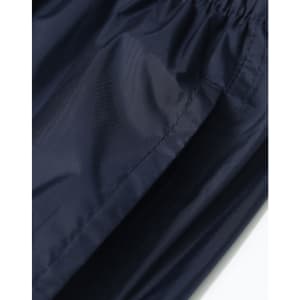 Lightweight nylon waterproof rain pants in navy, featuring an elastic waistband and a smooth texture.