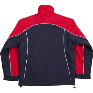 A reversible jacket featuring a navy blue body with red sleeves and contrast piping, and a logo on the design.