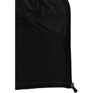 A close-up of the interior of a black softshell jacket, featuring a mesh pocket and zipper detail.