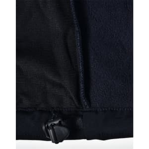 A close-up of a black ladies softshell jacket, highlighting the inner lining and adjustable hem detail.