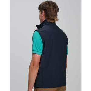 A navy men's softshell vest with a high collar, featuring a logo on the back, displayed on a model.