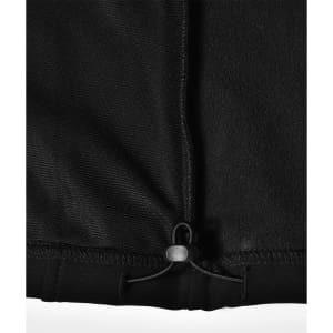 A black softshell vest featuring an adjustable hem and an inner fleece lining. It has a logo on the fabric.