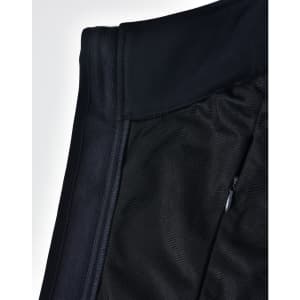 A close-up of a black ladies' softshell hi-tech vest showcasing its fabric textures and a zippered pocket.