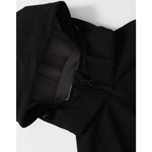 A black men's softshell full zip hoodie featuring a hood and zipped front. It has a logo on the fabric.