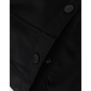 A close-up of a black men's softshell full zip hoodie, featuring snap buttons and textured fabric details.