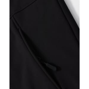 A close-up of a black softshell hoodie with a zippered side pocket and a logo.