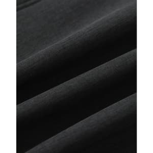 A close-up of a black softshell fabric with a smooth texture, featuring folds and creases.