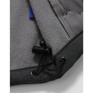 A close-up of the interior of a grey men's softshell full zip hoodie, featuring a drawstring and soft fabric lining.
