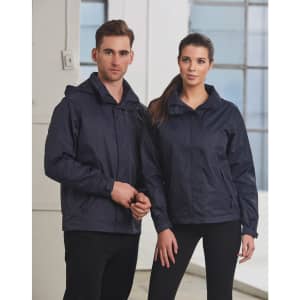 Two models wearing navy blue versatile jackets, standing side by side in a well-lit indoor space. The jackets have hoods and feature branding.