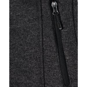 A dark grey fleece jacket with a zippered front and soft texture, featuring a small logo on the fabric.