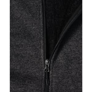 A ladies' grey bonded fleece jacket featuring a zip closure and soft inner lining. It includes a logo on the fabric.