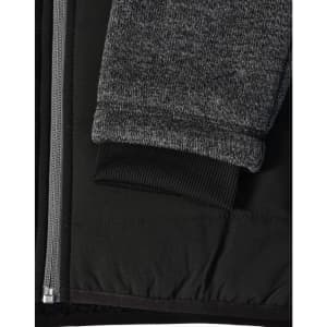 A black quilted jacket featuring heather grey sleeves and a ribbed cuff, with a side zipper and fabric texture detail.