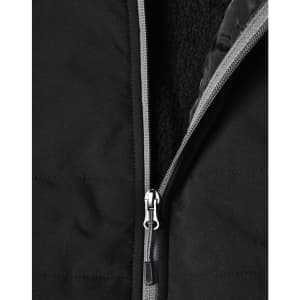 A black quilted jacket featuring a zippered closure and a soft interior lining. It has a logo on the surface.