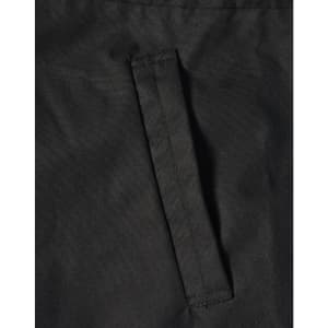 A close-up of a black fabric featuring a stitched pocket on a jacket. The material appears durable and textured.