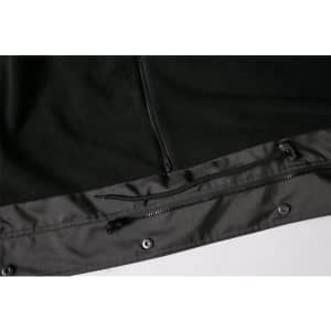 A black Long Line Stadium Jacket featuring a zippered pocket and snap fasteners at the hem. It has branding elements.