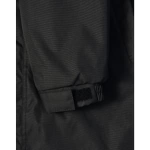 A close-up of a black long line stadium jacket featuring adjustable wrist cuffs and a logo.
