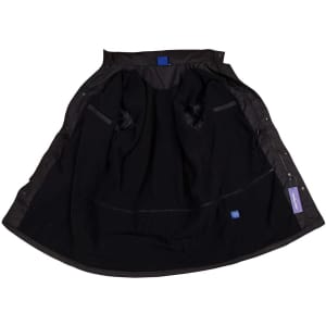 A long line stadium jacket in black, featuring a lined interior and pockets, with a branding tag visible.
