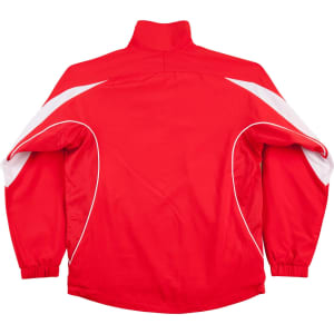 A red track jacket with white accents and a high collar, featuring a logo on the front.