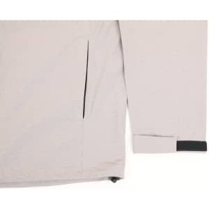 A light grey men's waterproof performance jacket featuring a zipped pocket and adjustable cuffs. The jacket includes branding.
