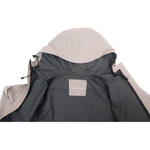 An interior view of a light grey men's waterproof performance jacket featuring a hood and a logo tag inside.