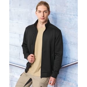 A man wearing a black jacquard fleece jacket over a beige shirt, set against a blue background. The jacket features a logo.