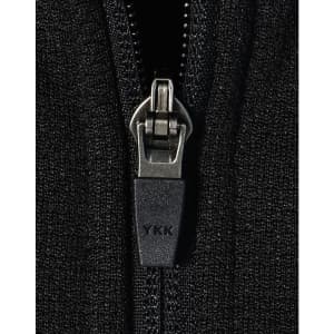 A close-up of a black zip on a fleece jacket featuring a YKK zipper. The fabric appears textured and soft.
