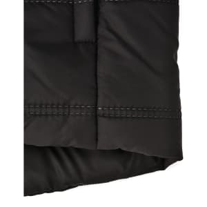 A black sustainable seamless parka jacket featuring a 3D cut with visible stitching details. It has a logo.
