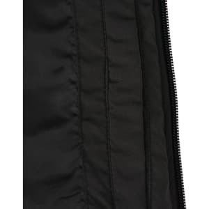 A close-up of a black parka jacket showing the textured fabric and inner lining details. It features a zipper and stitching.