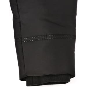 A close-up of a black sustainable parka jacket featuring a seamless design and detailed stitching at the cuff.