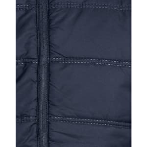 A navy blue unisex sustainable seamless parka jacket featuring a zip fastening and quilted texture.