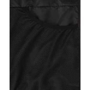 A close-up of a black puffer jacket's inner mesh lining, featuring a pocket and textured fabric.