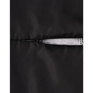 A close-up of a black insulated puffer jacket zipper, featuring a smooth, sleek design with contrast detailing.
