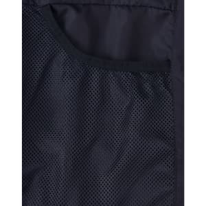 A close-up of a black insulated puffer jacket showing a mesh pocket. The jacket has a smooth fabric finish and a logo.