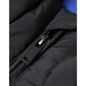 A close-up of a black insulated puffer vest showcasing the zipper and stitching details.