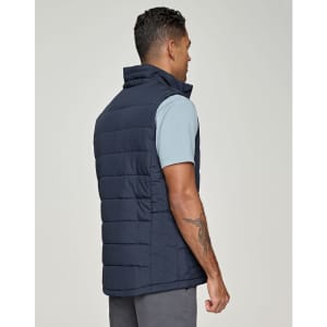 A men's sustainable insulated puffer vest in navy, featuring a 3D cut design, viewed from the back.