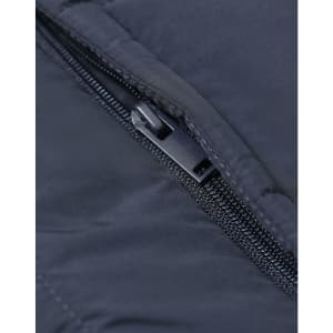 A close-up of a zip on a dark blue insulated puffer vest featuring a branded logo.