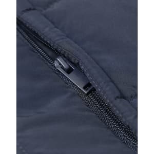 Close-up of a navy insulated puffer vest featuring a zippered pocket and a subtle logo.