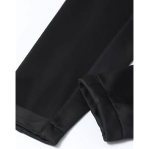 A black softshell corporate jacket with sleek, smooth fabric and finished sleeves. It features a logo on the fabric.